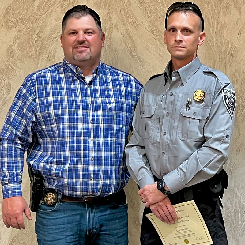 reserve deputy with sheriff winfrey after reserve swearing in